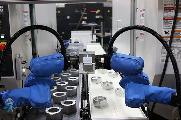 Two-UR5-robots-work-in-tandem-in-a-vision-controlled-machine-tending-application